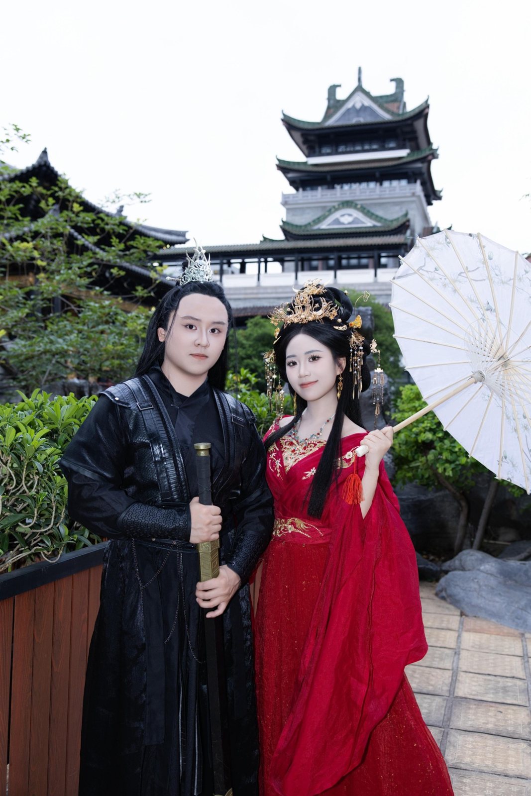 Justin and Cinderella in hanfu beneath a pagoda, Cinderella holding a paper parasol